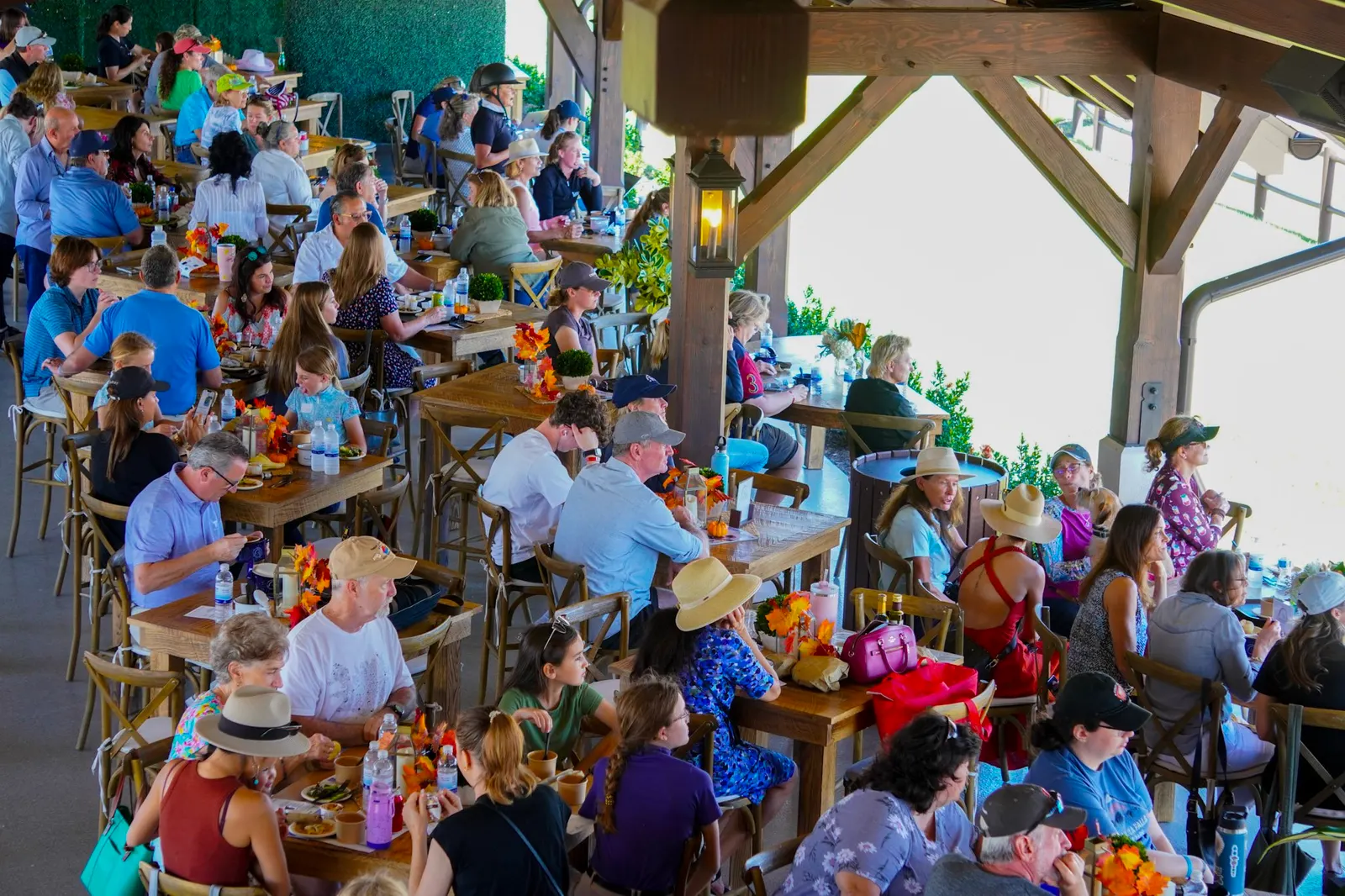 A full crowd of guests dining in the pavilion during the Empty Bowls fundraiser at TerraNova Equestrian Center. Photo by EQ Media.