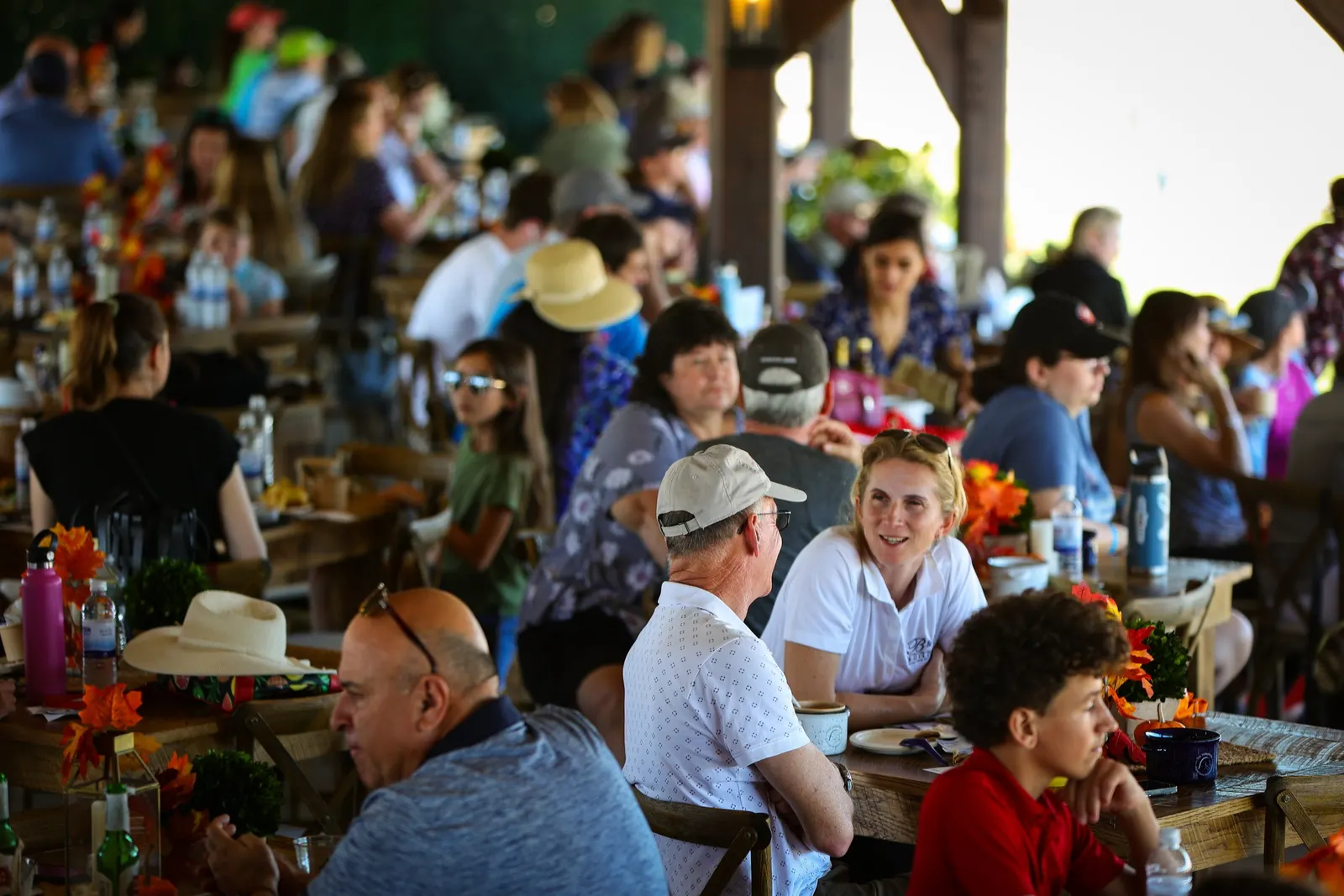Guests dining together at the Empty the Bowls VIP gathering during The Event at TerraNova. Photo by EQ Media.