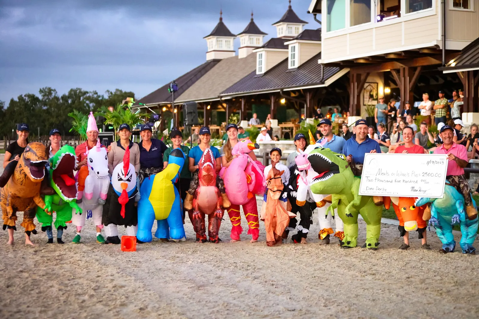 Competitors in colorful inflatable costumes lined up in the arena for the Exhibitor's Party at The Event at TerraNova. Photo by EQ Media.