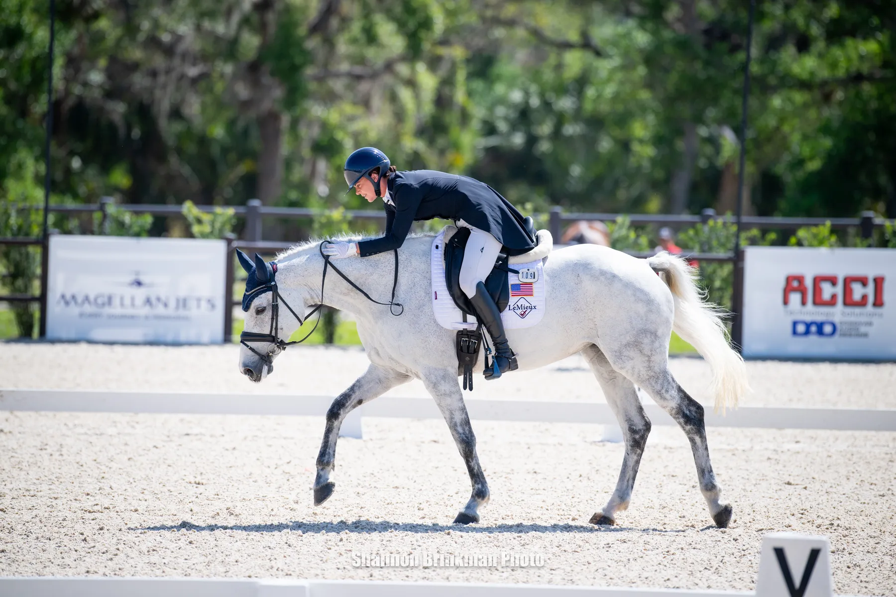 Hallie Coon and Cute Girl celebrate their dressage ride at The Event at TerraNova
