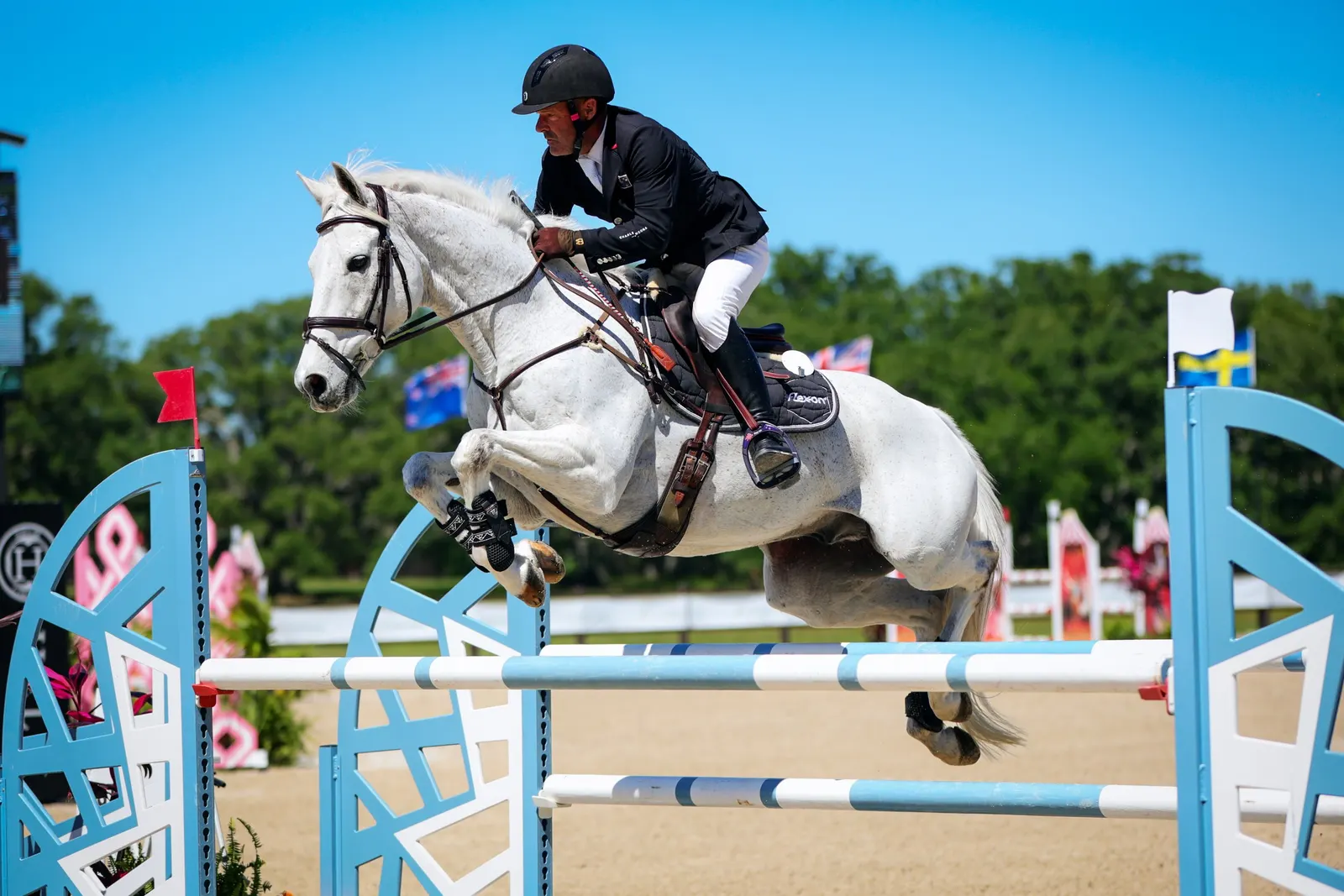 Joe Meyer riding the grey horse Harbin over a fence in the CCI4*-S show jumping phase at The Event at TerraNova. Photo by EQ Media.