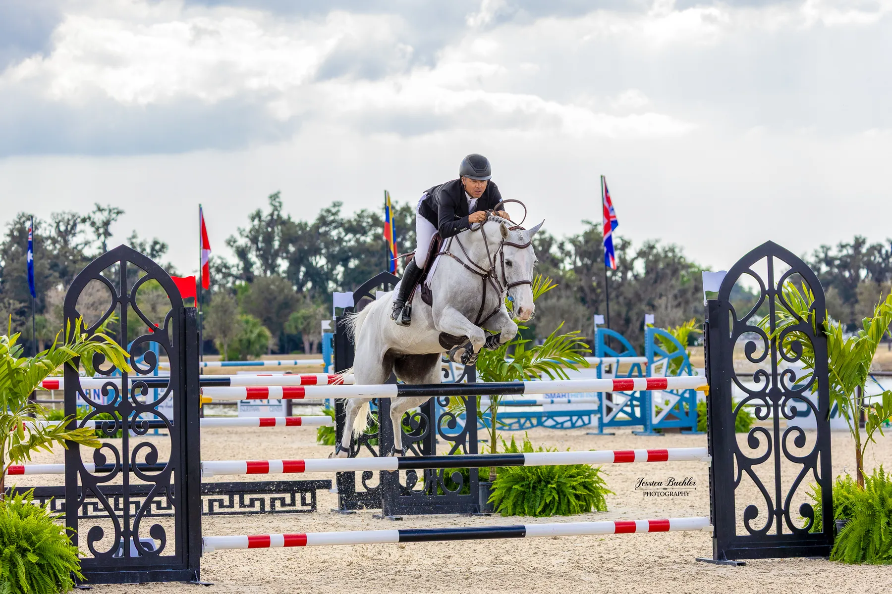 Kent Farrington riding the grey mare Diakatisa to win the $20,000 KB Squared Construction 1.35m TerraNova Prix