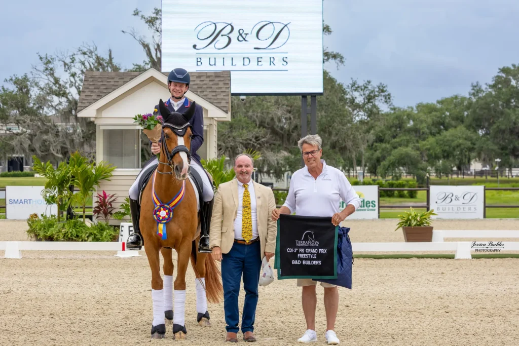 Kevin Kohmann accepting top honors in the B&D Builders CDI3 Grand Prix Freestyle at TerraNova