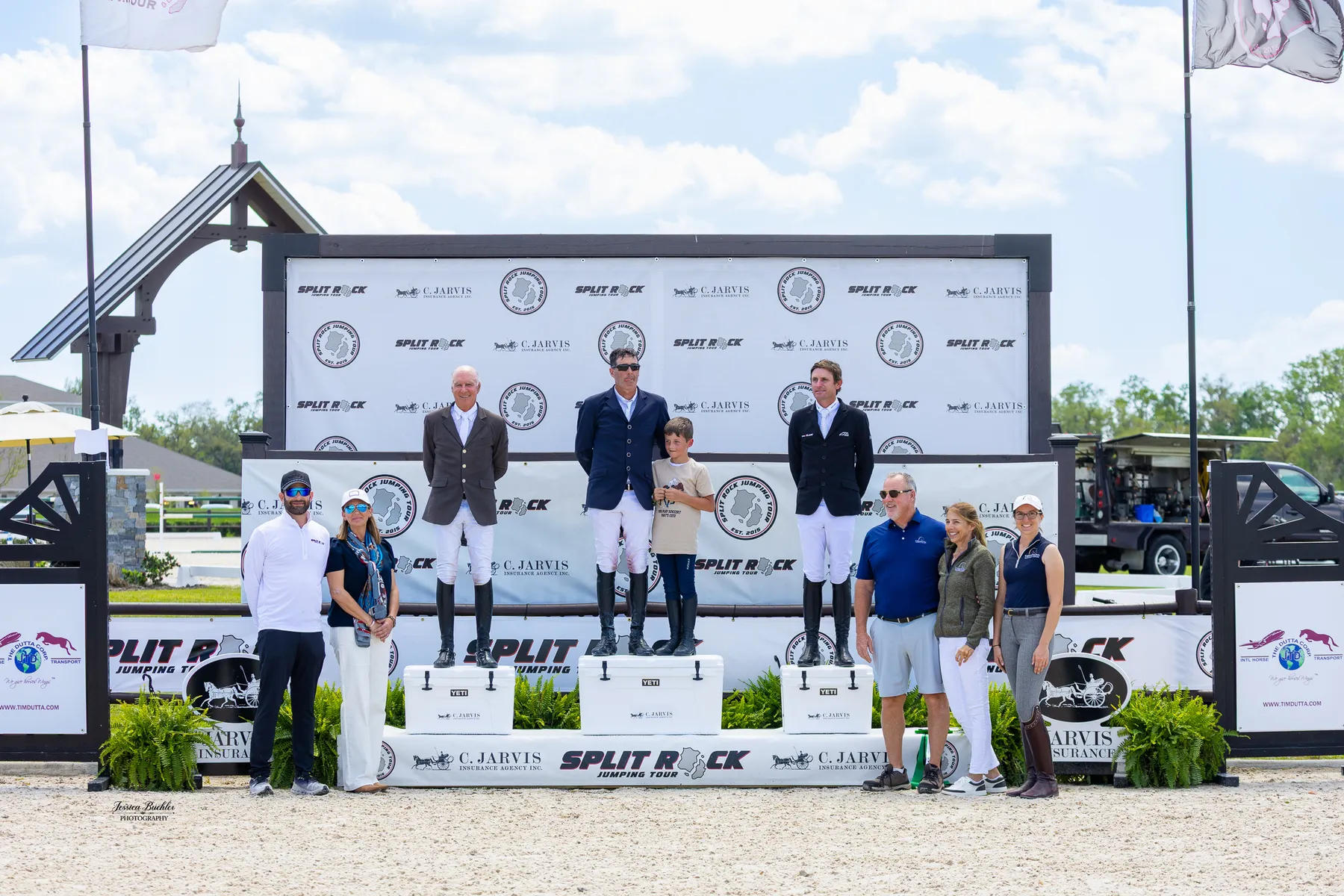 Paul O'Shea joined by his son on the podium at the TerraNova Winter Series