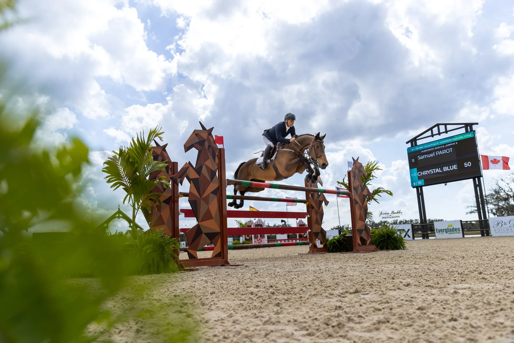 Samuel Parot riding Chrystal Blue over a jump to win the $24,999 The Estates at TerraNova Welcome Prix