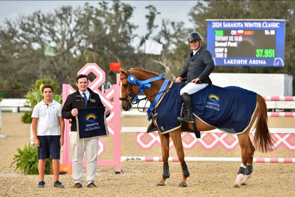 Samuel Parot and Tiffany de Olid accept prizes after winning the $35,000 Grand Prix of Sarasota at TerraNova
