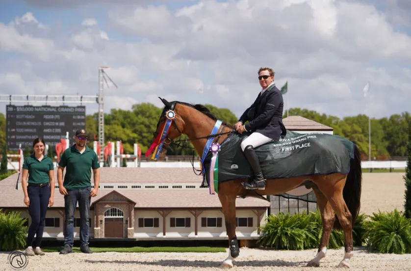 Hannah Herrig-Ketelboeter and Zach Ketelboeter present the award to Scott Keach and Fedor at the TerraNova Spring Series Grand Prix
