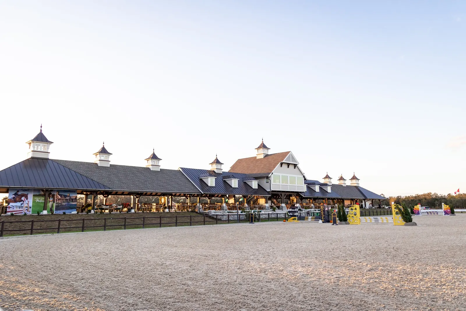 The pavilion and competition arena at TerraNova Equestrian Center under an evening sky